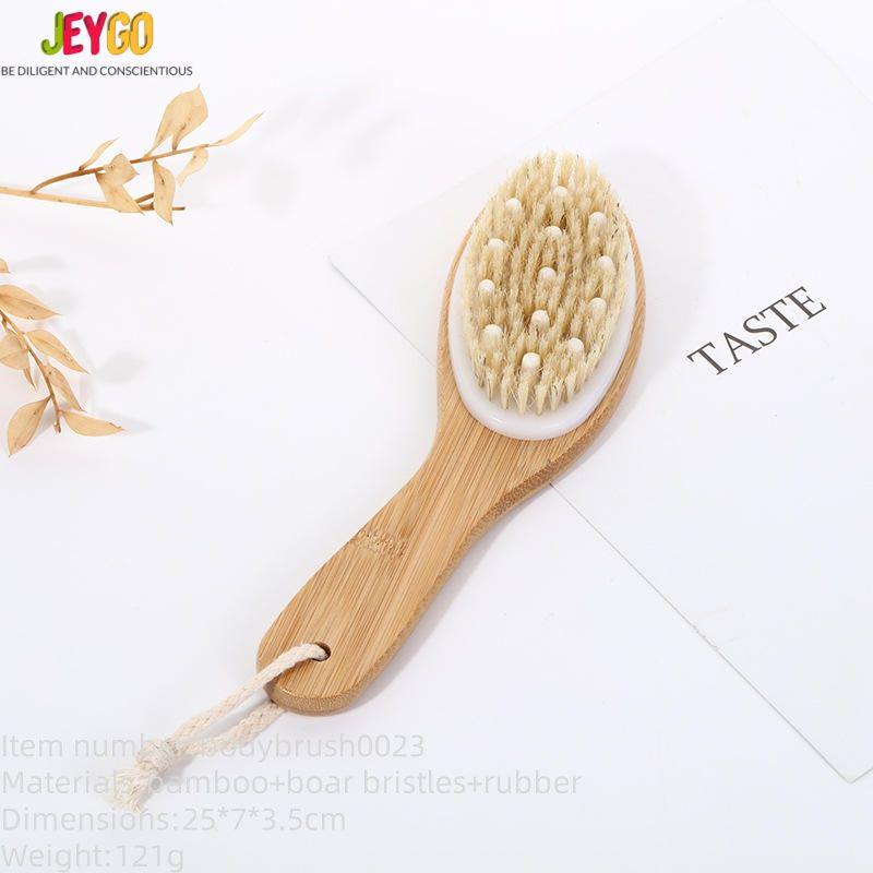 A boar bristle brush with a long handle, designed for exfoliating the body and promoting smooth, healthy skin.