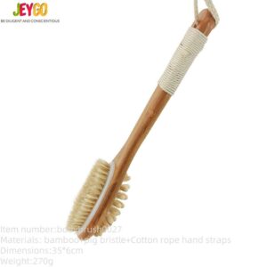 A bath brush with a bamboo handle and natural pig bristles, designed for dry brushing and exfoliating the body.