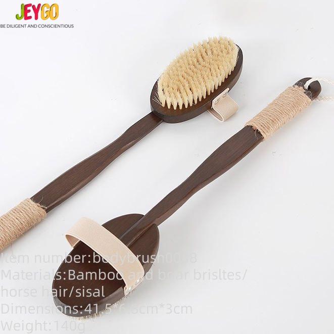 Natural bristle scrub brush with dark bamboo handle, featuring soft bristles and a strap for exfoliating and full-body cleansing.