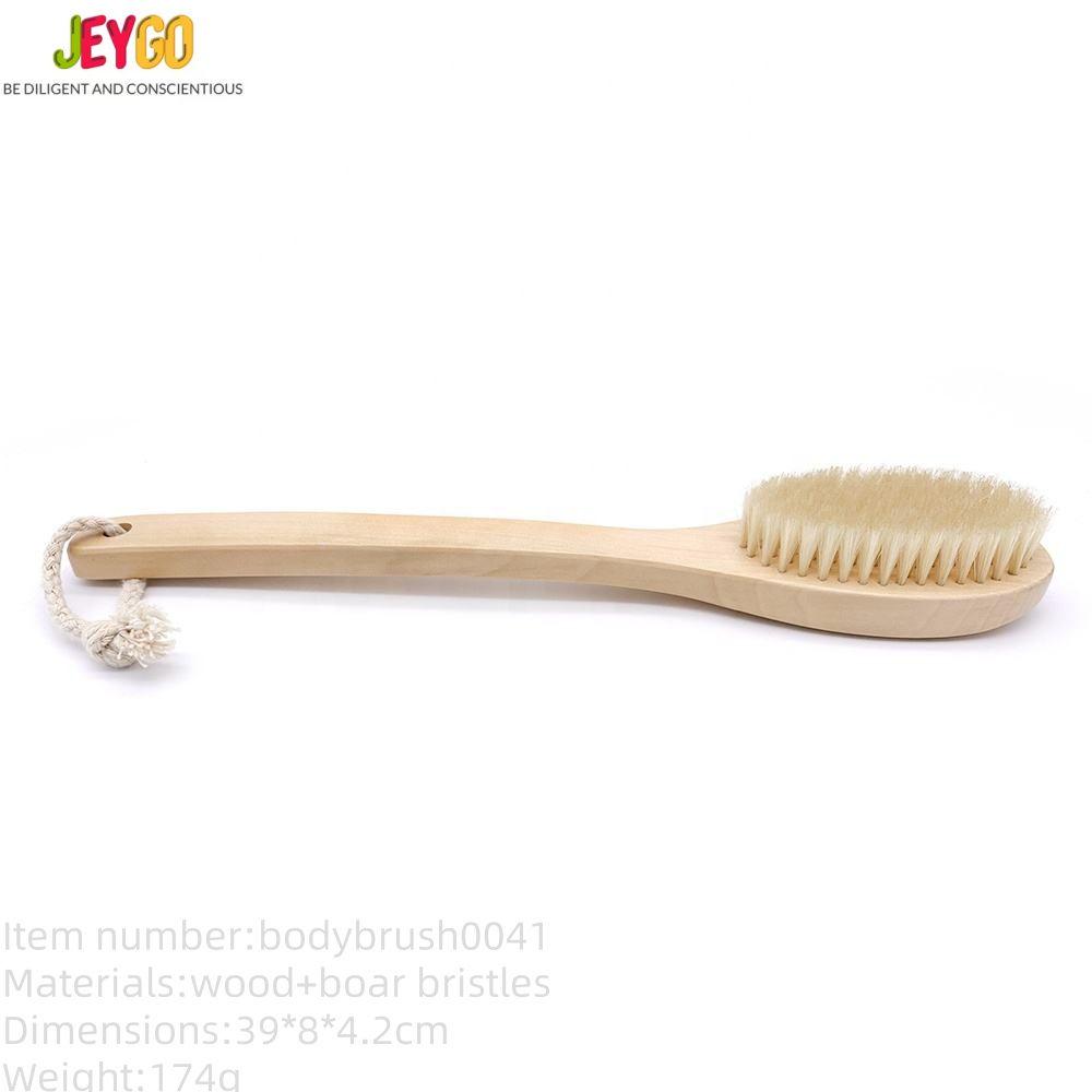 Natural bristle scrub brush with a long wooden handle, featuring soft boar bristles for gentle exfoliation during bathing.