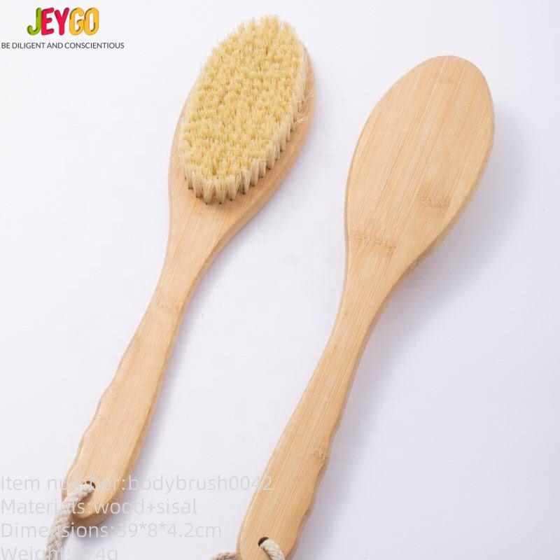 Natural scrub brush made with bamboo and sisal bristles, designed for gentle exfoliation and daily bathing.