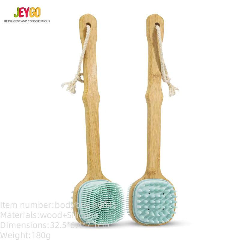 Silicone massage brush with a long wooden handle, featuring soft silicone bristles for bathing, exfoliation, and body massage.