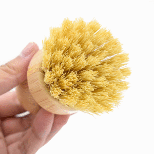 Eco-friendly bamboo dish scrub brush with natural sisal and palm fiber bristles, perfect for kitchen cleaning.