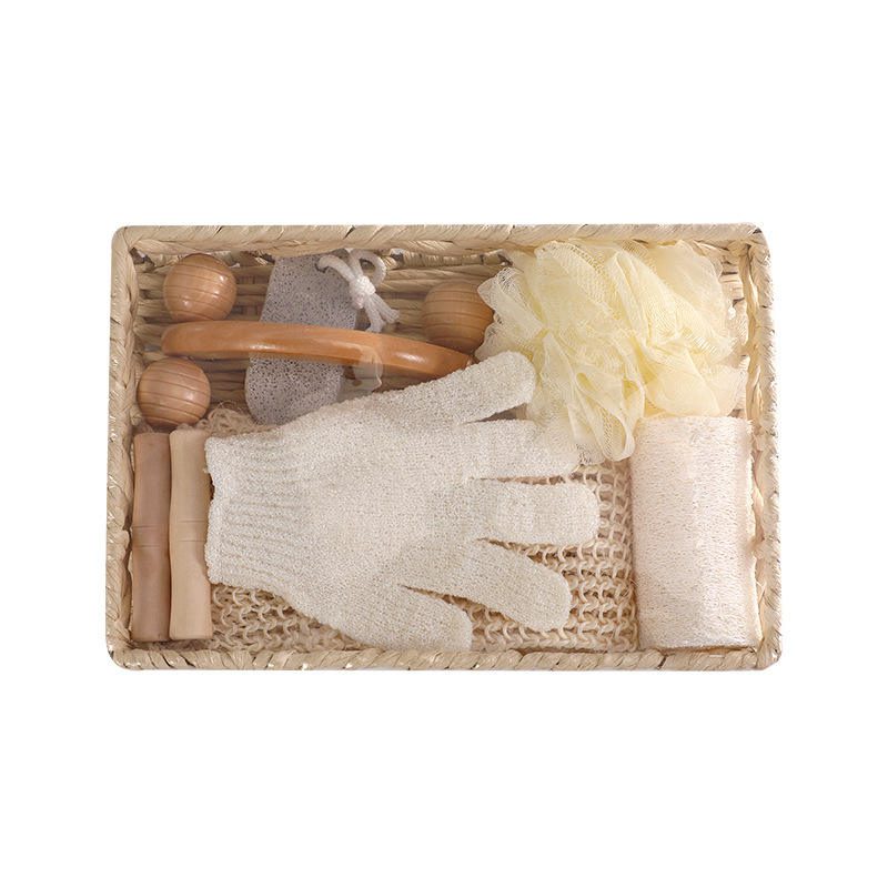 Shower gift set featuring body wash essentials like loofah, pumice stone, massager, gloves, and bath flower in a woven basket.