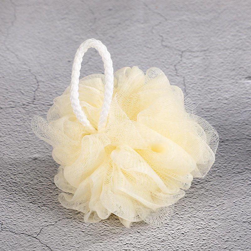 Shower gift set featuring body wash essentials like loofah, pumice stone, massager, gloves, and bath flower in a woven basket.