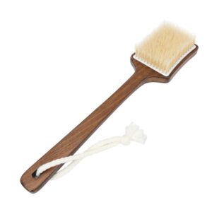 Bath brush with long handle made of dark wood and natural bristles, designed for dry body brushing and exfoliation.