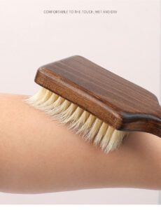 Bath brush with long handle made of dark wood and natural bristles, designed for dry body brushing and exfoliation.