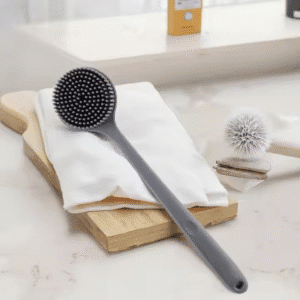 Bath brush with long handle featuring exfoliating, massaging silicone bristles for effective shower cleaning.