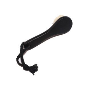 Black body dry brush with soft goat hair bristles and compact handle, designed for gentle exfoliation.