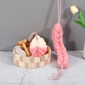 Christmas bath towel set displayed in a wooden bowl with bath sponges, foot care products, and massage accessories.