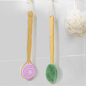Double-sided shower brush with a long bamboo handle and soft silicone bristles for cleansing and massage.