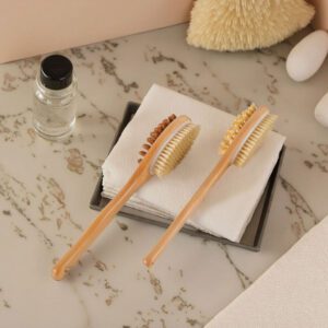 Natural bristle scrub brush with a long wooden handle and dual-side design, suitable for exfoliating as a natural scrub brush.