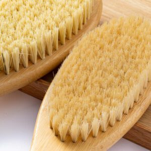 Natural scrub brush made with bamboo and sisal bristles, designed for gentle exfoliation and daily bathing.