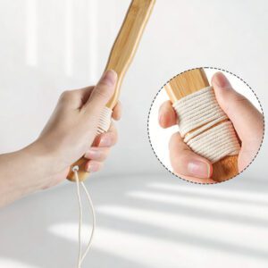 Shower back scrubber with a long wooden handle and soft cleansing pad, designed for bathing and body care.