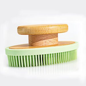 Silicone bath brush with bamboo handle for cleaning and exfoliating, featuring a soft grip design.