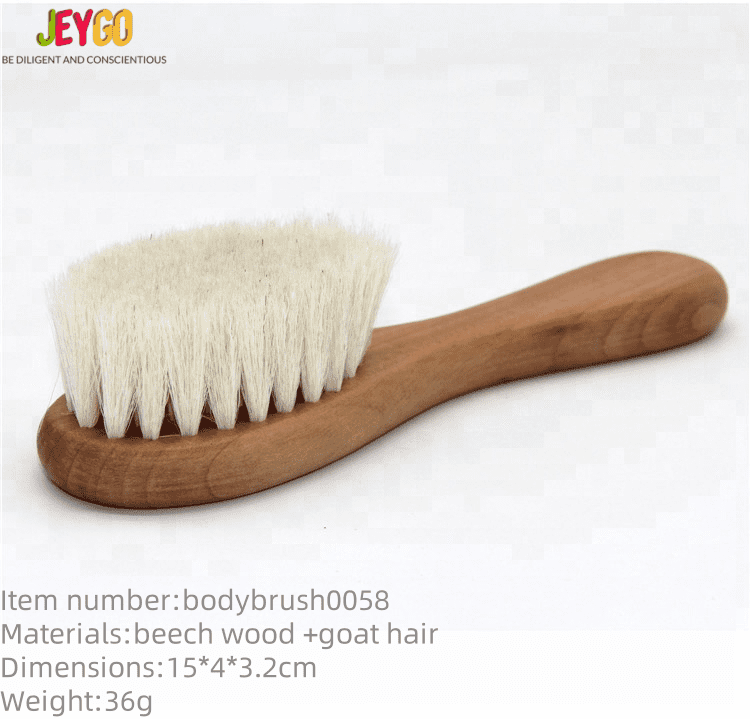 Wooden baby brush made of beech wood with soft wool bristles, designed as a natural children’s hair brush.