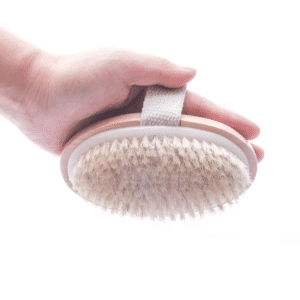 Long handle brush for bathing with natural wood handle and soft bristles, designed for full-body exfoliation.