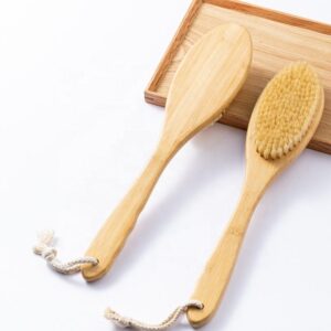 Skin care brush with bamboo handle and sisal bristles, designed for gentle exfoliation and healthy skin care routines.