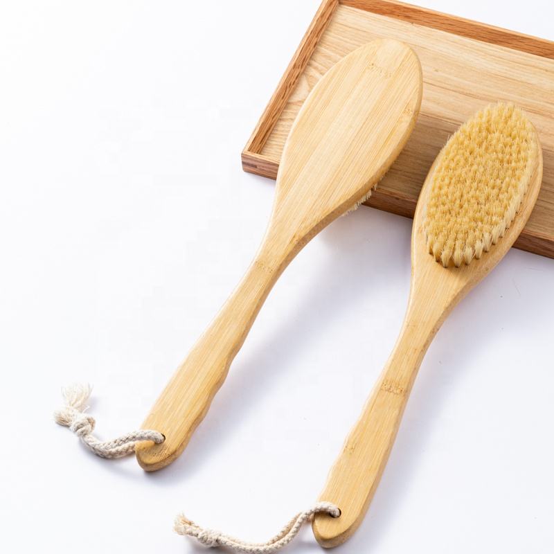 Skin care brush with bamboo handle and sisal bristles, designed for gentle exfoliation and healthy skin care routines.