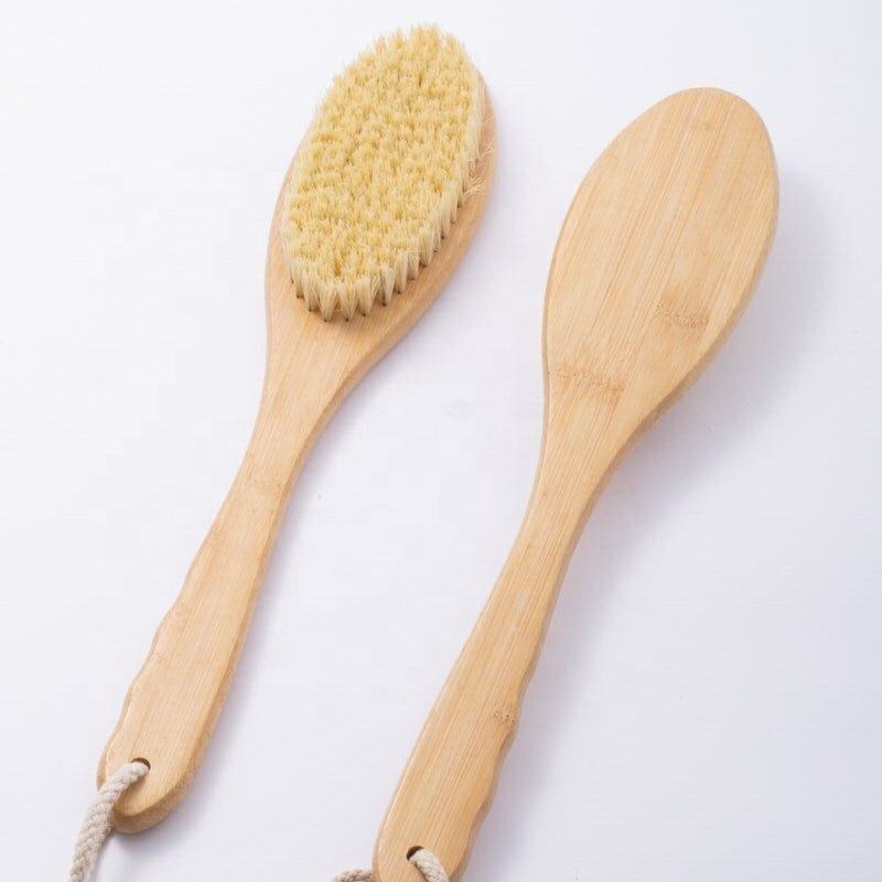 Skin care brush with bamboo handle and sisal bristles, designed for gentle exfoliation and healthy skin care routines.