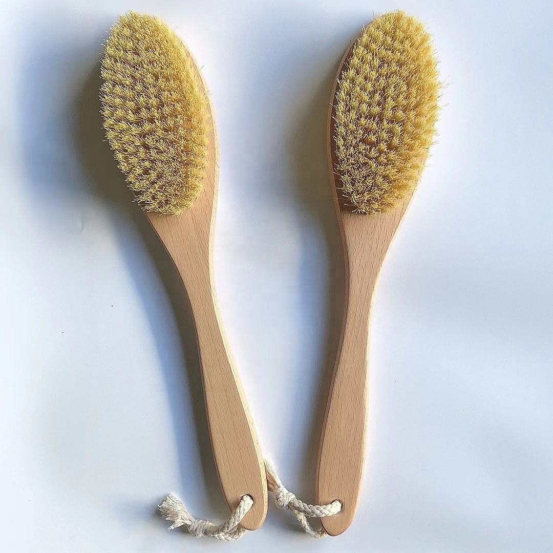 Skin care brush with bamboo handle and sisal bristles, designed for gentle exfoliation and healthy skin care routines.