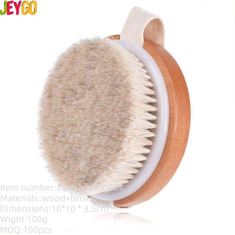 Round handheld body brush with boar bristles and strap for dry brushing and shower exfoliation