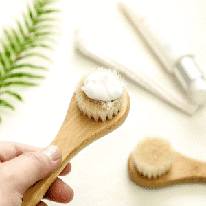 Bamboo handle cleaning brush with soft bristles for face washing and gentle skin exfoliation