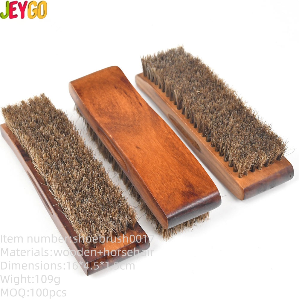 black wooden shoe brush with soft light and dark horsehair bristles for leather shoe polishing and cleaning