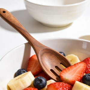 This acacia wood kitchen spoon fork is a versatile serving utensil crafted from durable natural acacia wood with a smooth polished finish. Designed for salad tossing, pasta serving, fruit mixing, and everyday kitchen cooking, it combines the functionality of a spoon and fork in one elegant tool. The ergonomic long handle provides a comfortable grip while protecting non-stick cookware from scratches. Suitable for home kitchens, restaurants, catering services, and eco-friendly tableware collections. Lightweight, reusable, and durable, this wooden kitchen utensil is ideal for wholesale kitchen utensils, salad serving tools, and wooden cookware accessories.