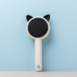 green self cleaning pet grooming brush with stainless steel pins for dogs and cats
