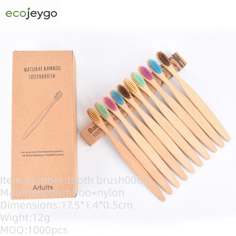 Pack of ten eco-friendly bamboo toothbrushes with colorful BPA-free bristles and recyclable kraft paper packaging, designed for adults and sustainable oral care