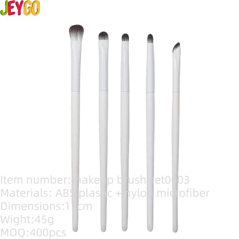 White makeup brush set with vegan synthetic bristles, including foundation, blending, eyeshadow, detail, and angled makeup brushes for precise cosmetic application and professional beauty routines.