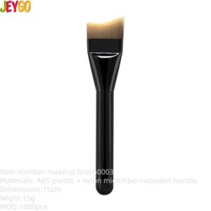 Professional tongue shaped foundation brush with soft synthetic bristles and black handle, designed for liquid foundation, facial masks, skincare products, and smooth face coverage.