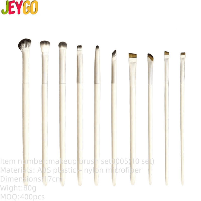 Set of ten white synthetic makeup brushes with ultra-fine flat, angled, and silkworm blade tips for eyeliner, eyebrows, eyeshadow, and detailed eye makeup application.