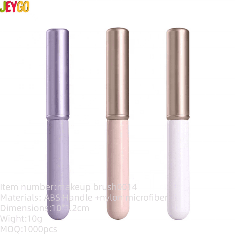 Portable lip brush with protective cap, synthetic bristles, and compact handle, designed for lipstick application, concealer touch-ups, and travel makeup use.