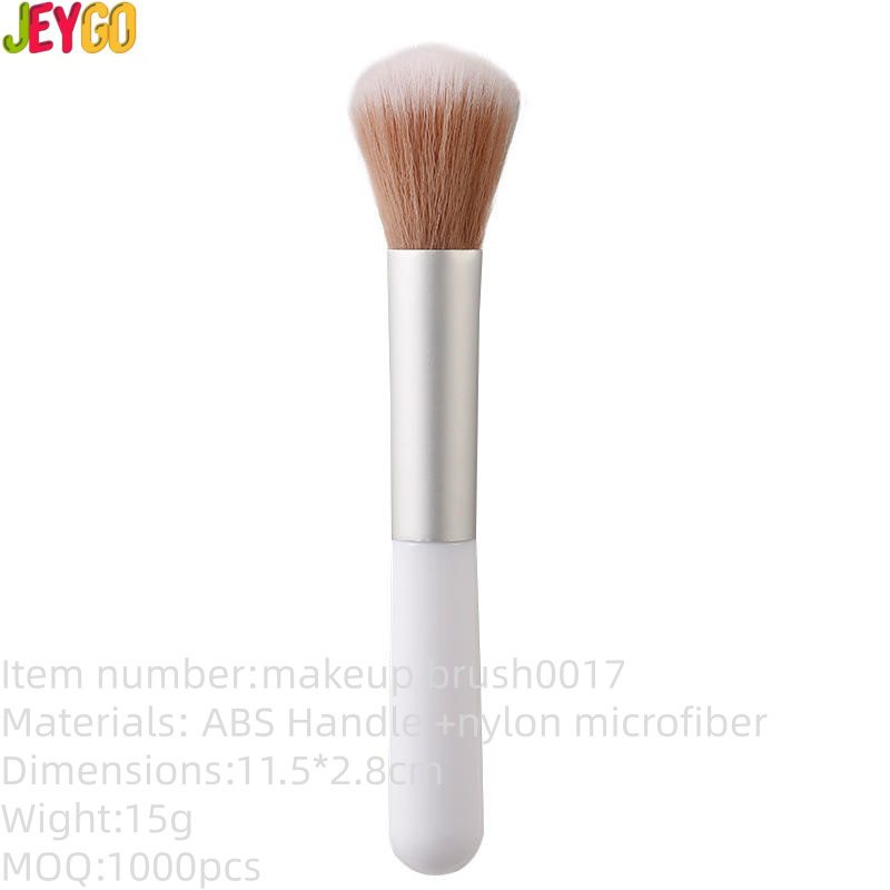 Compact single makeup brush with a white handle, silver ferrule, and soft synthetic bristles for foundation, blush, powder, and everyday cosmetic use.