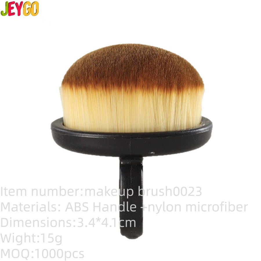 Compact round nail cleaning brush with soft synthetic bristles and black handle designed for removing nail art dust, powder, and manicure residue.