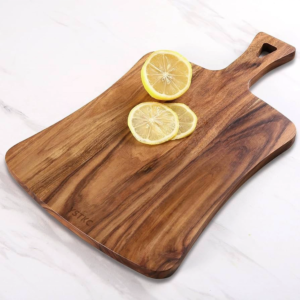 Rectangular acacia wood cutting board with handle, ideal for serving cheese, charcuterie, bread, and fruits, suitable for home kitchens and restaurants