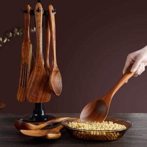 Twelve-piece set of natural teak wooden kitchen utensils including spatulas, slotted spoons, soup spoons, serving utensils, and stirring tools, designed for cooking and serving