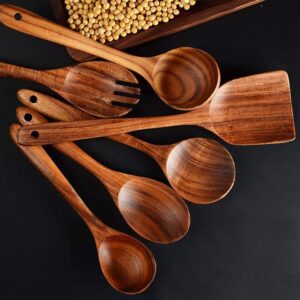 Twelve-piece set of natural teak wooden kitchen utensils including spatulas, slotted spoons, soup spoons, serving utensils, and stirring tools, designed for cooking and serving