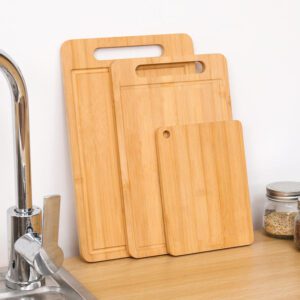 rectangular bamboo cutting board with integrated handle slot and juice groove for kitchen chopping tasks