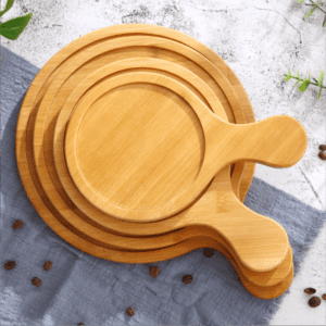 round bamboo pizza board with paddle handle and juice groove for serving pizza, cheese, bread and appetizers
