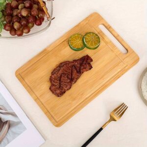 natural bamboo cutting board with built-in handle and juice groove for chopping, slicing and serving food