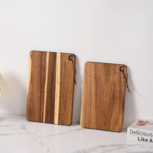 Two acacia wood cutting boards with hanging holes, ideal for chopping, slicing, and kitchen prep, suitable for home kitchens and commercial use