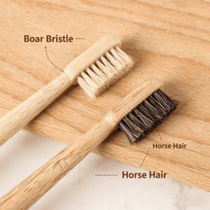 Four-piece bamboo toothbrush set with natural horse hair and boar bristle brush heads, custom logo bamboo handles, and eco-friendly kraft paper packaging for sustainable oral care
