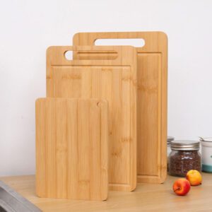 rectangular bamboo cutting board with integrated handle slot and juice groove for kitchen chopping tasks