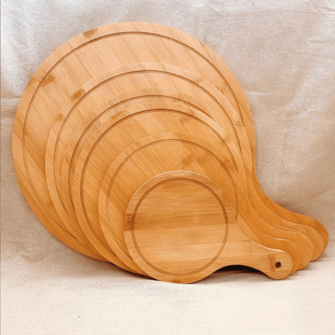 round bamboo pizza board with paddle handle and juice groove for serving pizza, cheese, bread and appetizers