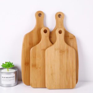 large bamboo cutting board with rounded handle and hanging hole for food preparation and serving