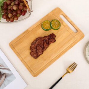 rectangular bamboo cutting board with integrated handle slot and juice groove for kitchen chopping tasks