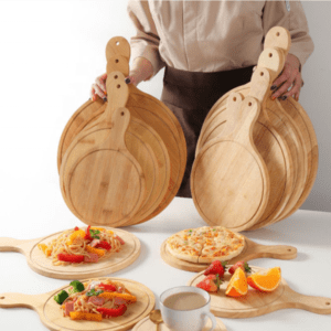 round bamboo pizza board with paddle handle and juice groove for serving pizza, cheese, bread and appetizers